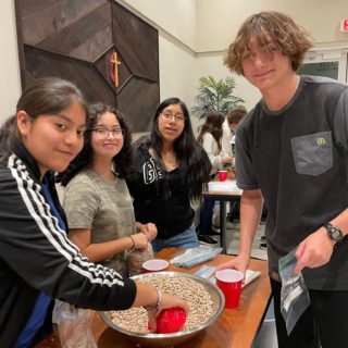 Our Youth group working hard and working as a team to help prep for the Thanksgiving Food build project. And, yes they had fun doing it together too!